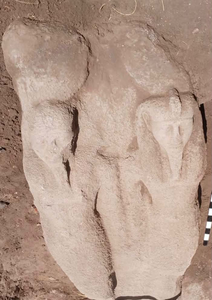 rough stone statue showing ramses II formed in sandstone