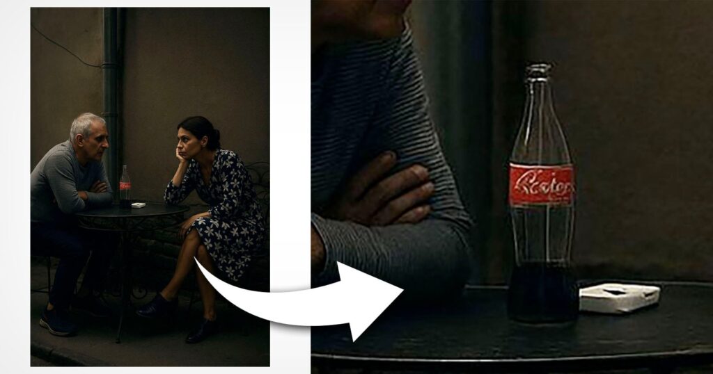 AI-Generated ‘Photo’ Disqualified From Hasselblad Masters 2026 A man and woman sit at a small round table outdoors at night, engaged in conversation. An arrow highlights a close-up of a Coca-Cola bottle and a white ashtray on the table.
