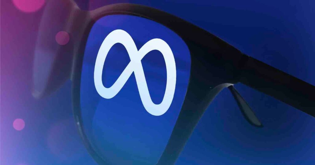 Meta Removes Facial Recognition Code from Ray-Ban Smart Glasses App A pair of black sunglasses with the white Meta logo reflected in one lens against a blue and purple background.