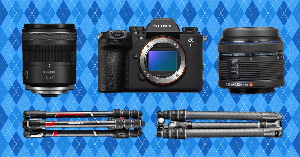 A Sony Alpha camera is centered between a Canon lens and an Olympus lens. Below are two folded carbon fiber tripods, all on a blue patterned background.