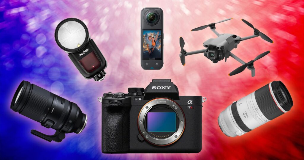Save Big on Cameras, Lenses, Lights, and More With the Best Fourth of July Photography Deals A digital collage featuring a Sony camera, two camera lenses, a Godox flash, a 360-degree camera, and a gray drone, all set against a vibrant, blurred red and blue background.
