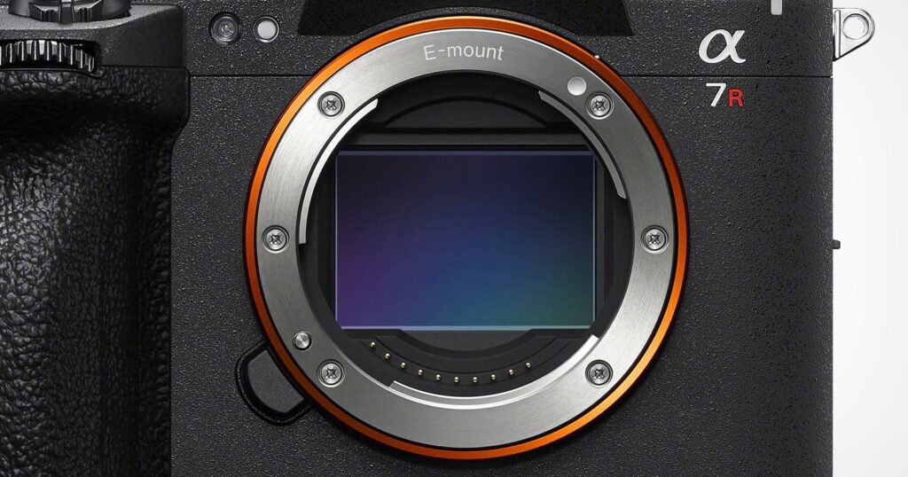 Sony List of Official E-Mount Partners Has Some Interesting Exclusions A close-up view of a camera lens mount with a visible sensor, featuring the text "E-mount" and "α 7R" on the camera body.