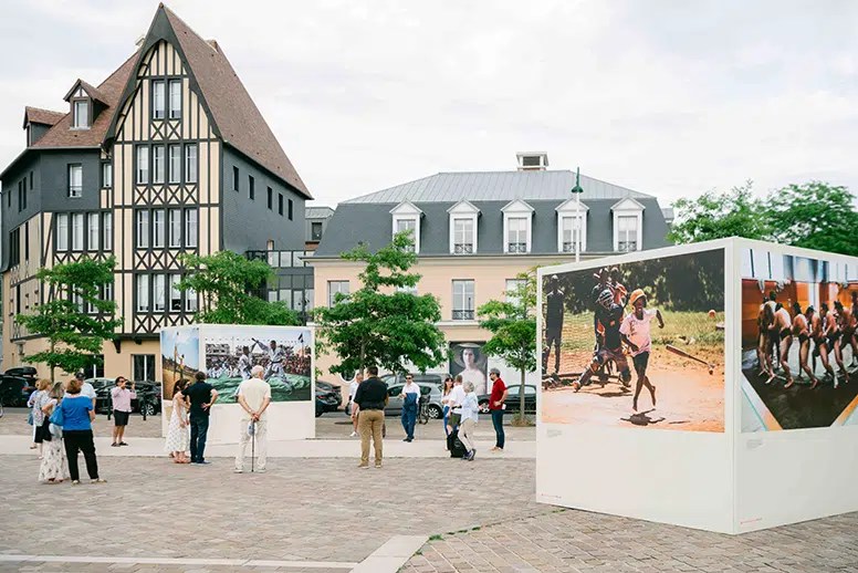 French Court Faults Deauville City Hall for Removing Gaza Photograph People admire an outdoor exhibition of photographs at the 2025 Deauville Sport Images Festival.