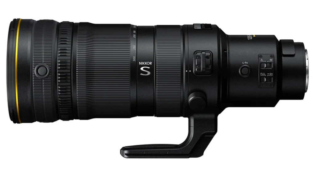 Nikon NIKKOR S telephoto zoom lens with gold accent ring and tripod collar, shown horizontally on a white background