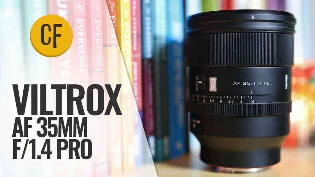 Viltrox AF 35mm f/1.4 Pro Review: Worth $829? Black Viltrox AF 35mm f/1.4 Pro FE lens on a wooden shelf before colorful book spines, with a review title overlay.